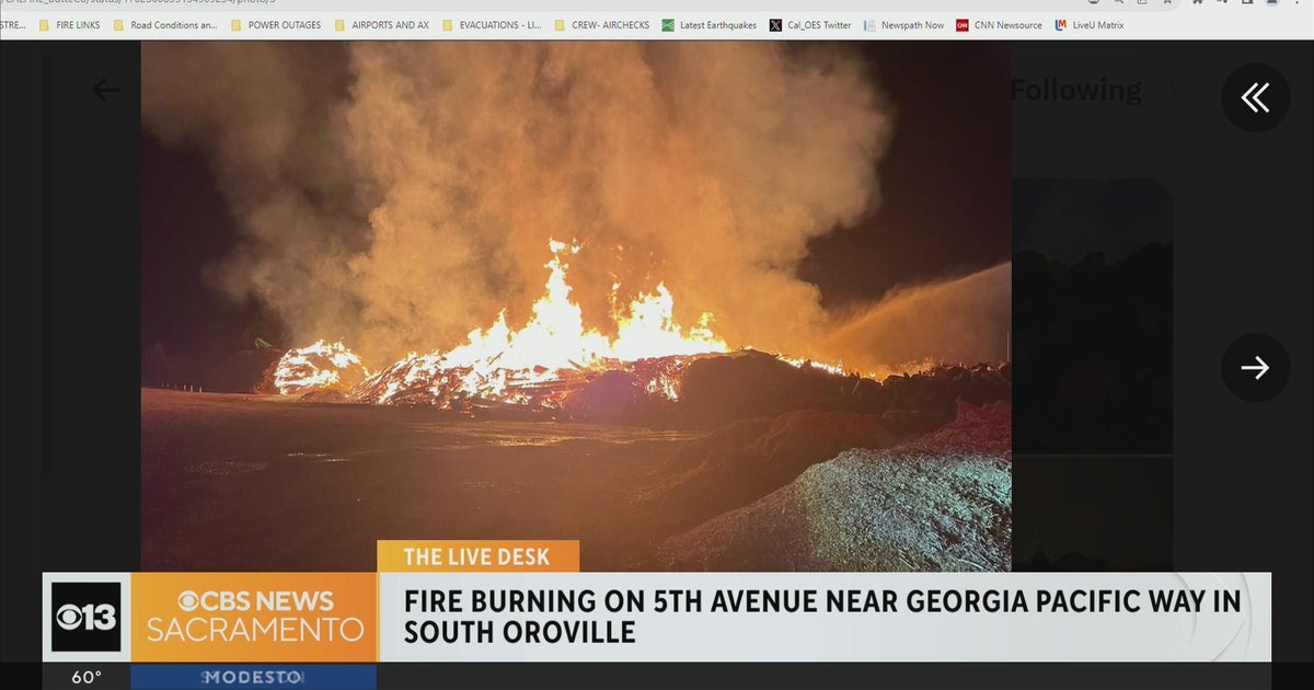 Large wood pile catches fire in South Oroville