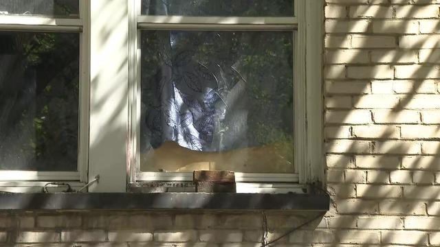 A broken window at a Plainfield apartment complex 