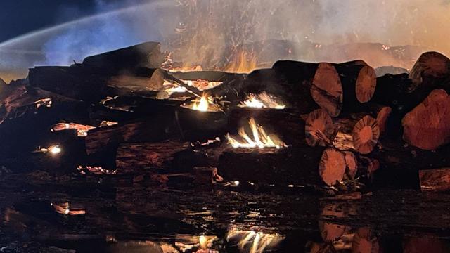 fire in pile of wood in Oroville 