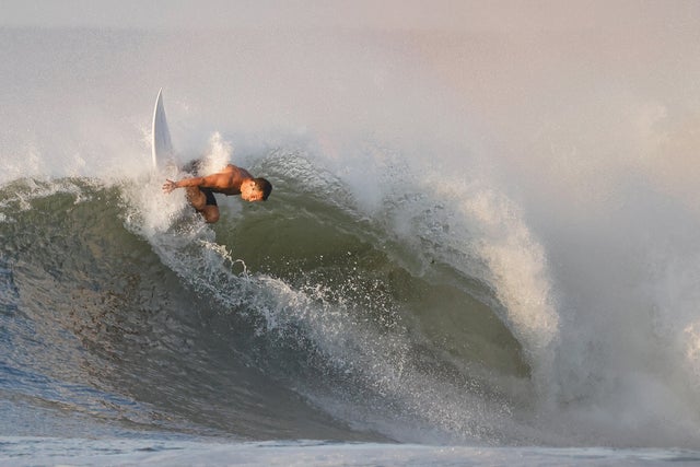 Surfer riding a wave off Long Island 