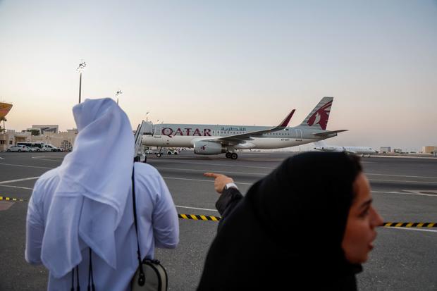 A Qatari jet carrying five U.S. citizens who were held in Iran lands at the Doha International Airport 