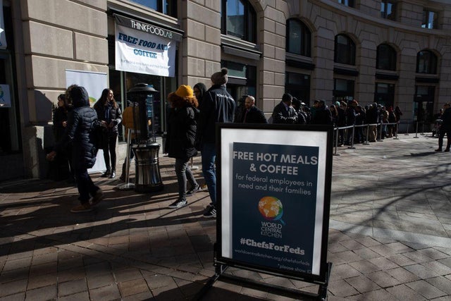 Federal workers line up outside chef and activist Jose Andres' World Central Kitchen to receive free meals and goods amid a partial government shutdown in Washington on Jan. 22, 2019. 