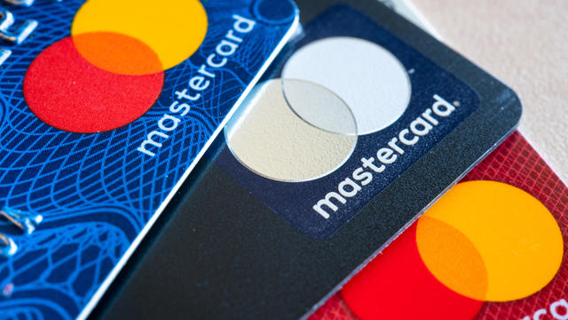 In this photo illustration there are three Mastercard Credit 
