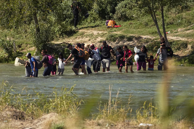 Migrants cross the Rio Grande from Mexico into the U.S. on Thursday, Sept. 21, 2023, in Eagle Pass, Texas. 