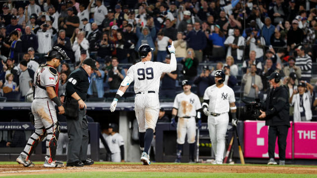New York Yankees right fielder Aaron Judge (99) gestures at home plate after hitting a solo home run in the seventh inning during a regular season game between the Arizona Diamondbacks and New York Yankees on September 22, 2023 at Yankee Stadium in the Br 