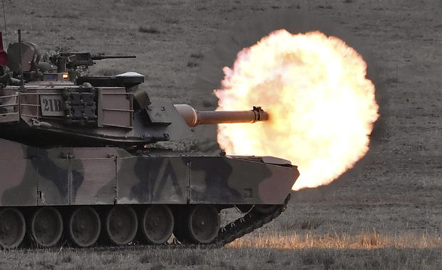 An Australian army M1A1 Abrams main battle tank fires a round at a target during a live fire demonstration at the Puckapunyal Military Base north of Melbourne on May 9, 2019. 