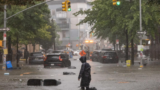 New York,  NY - September 29:A person walks on a flooded str 
