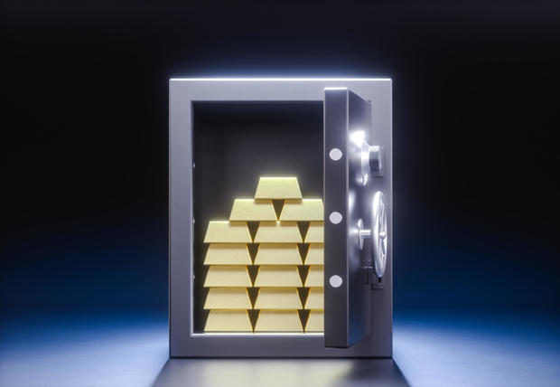 3D illustration. An open safe deposit box with a stack of gold bars inside. 