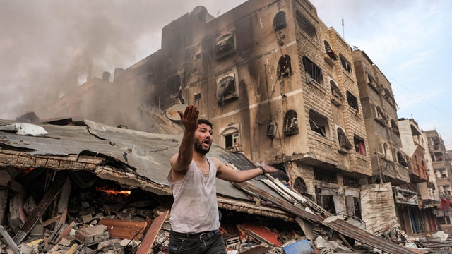 Israel hammers Hamas-ruled Gaza with 4th night of airstrikes as Israelis find a massacre at a kibbutz