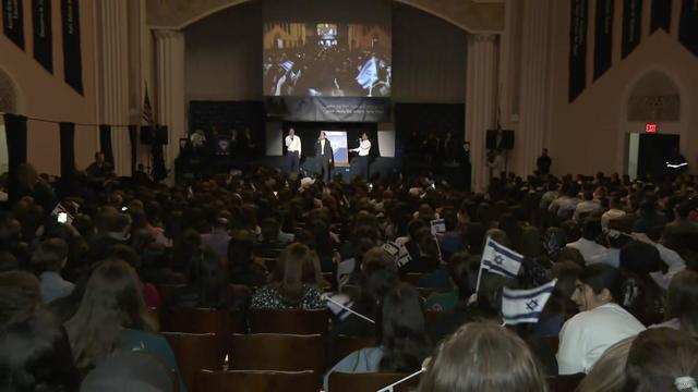 Students gather in an auditorium at Yeshiva University. 