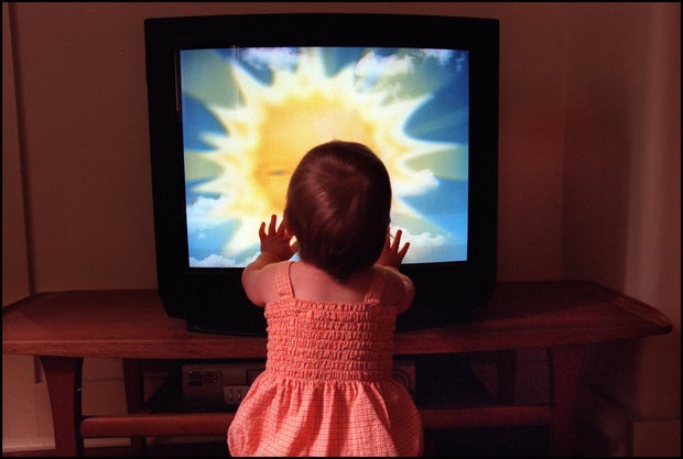 A toddler watches Teletubbies on television set on 28 December 2001. AFR GENERI