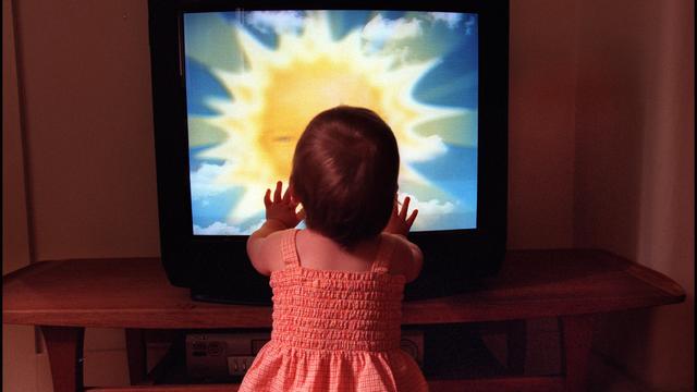 A toddler watches Teletubbies on television set on 28 December 2001. AFR GENERI 
