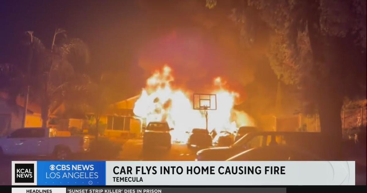 Car flies off freeway, destroys home