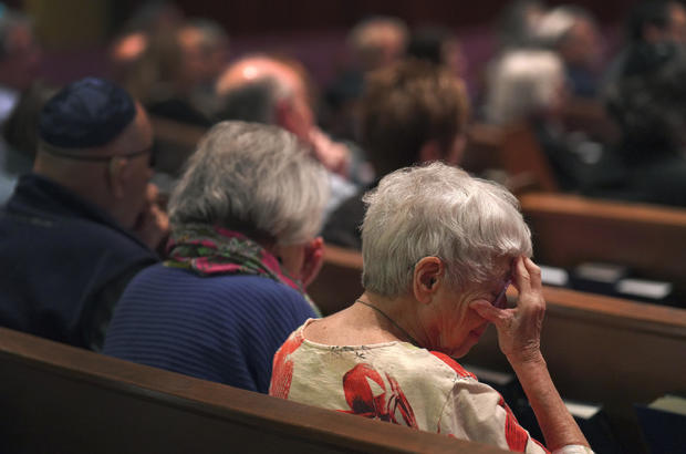 Worshippers are seen sitting in silent prayer while at a Shabbat service at Temple Sinai in Pittsburgh on Oct. 13, 2023. Photo by Jessie Wardarski / AP 