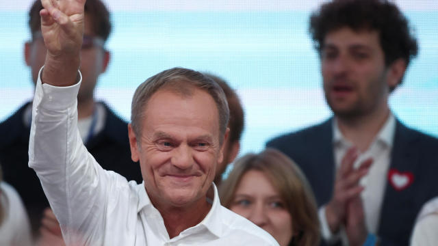 Donald Tusk, leader of the opposition group Civic Coalition, gestures after exit poll results are announced in Warsaw, Poland, Oct. 15, 2023. 