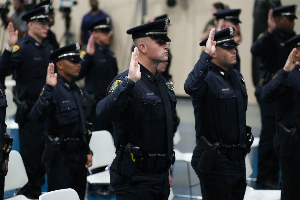 Houston Police Cadet Class 254 take the oath of office during their graduation at the Houston Police Academy Thursday, July 7, 2022 in Houston. 