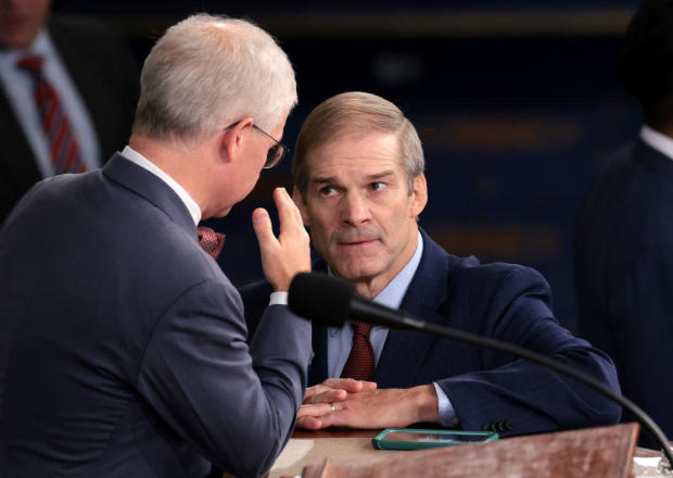 Rep. Jim Jordan talks to Speaker Pro Tempore Rep. Patrick McHenry as the House prepares to hold a vote on a new speaker of the House on Oct. 18, 2023. 