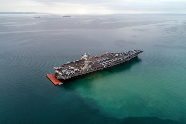 The American aircraft carrier USS Gerald R. Ford is seen from the air anchored in Italy in the Gulf of Trieste. Photo by Andrej Tarfila/SOPA Images/LightRocket via Getty Images