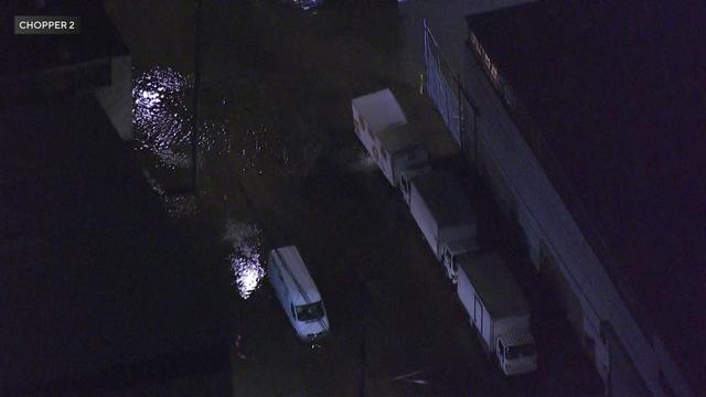 An aerial view of water flooding Queens streets. 