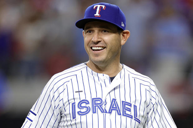 Former Texas Rangers Ian Kinsler walks out to throw the ceremonial first pitch prior to Game Three of the American League Championship Series on October 18, 2023, in Arlington, Texas. 