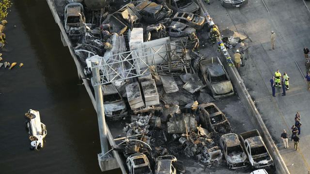 In this aerial photo, responders are seen near wreckage of a multi-vehicle pileup on I-55 in Manchac, La., on Oct. 23, 2023. 