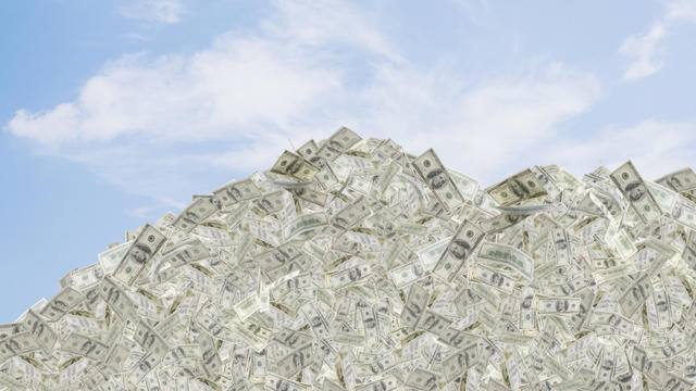 Illustration of mountain of dollar bills 