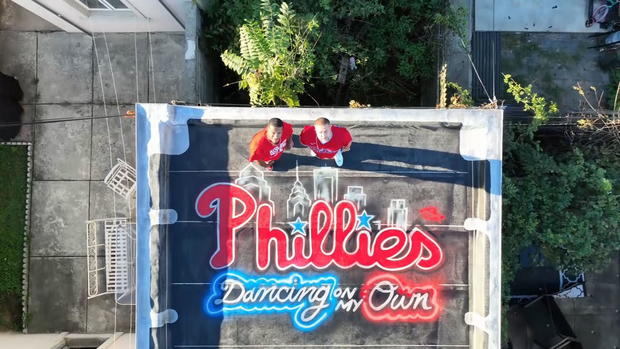 philadelphia-roofer-artist-team-up-to-paint-city-red-with-phillies-pride.jpg 