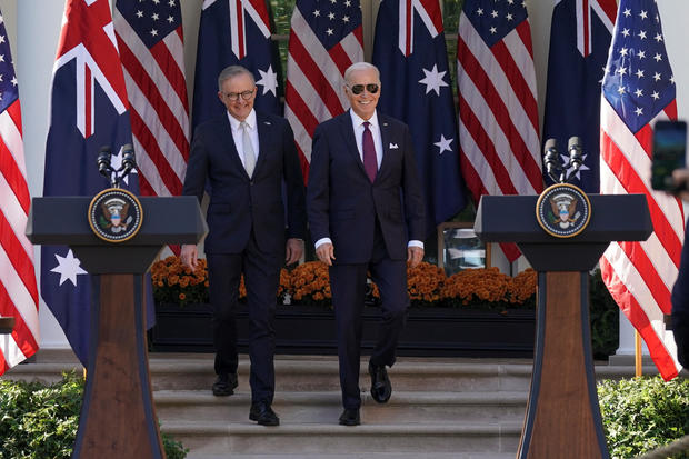 President Biden and Australian Prime Minister Anthony Albanese arrive for a joint press conference in the Rose Garden at the White House on Oct. 25, 2023. 