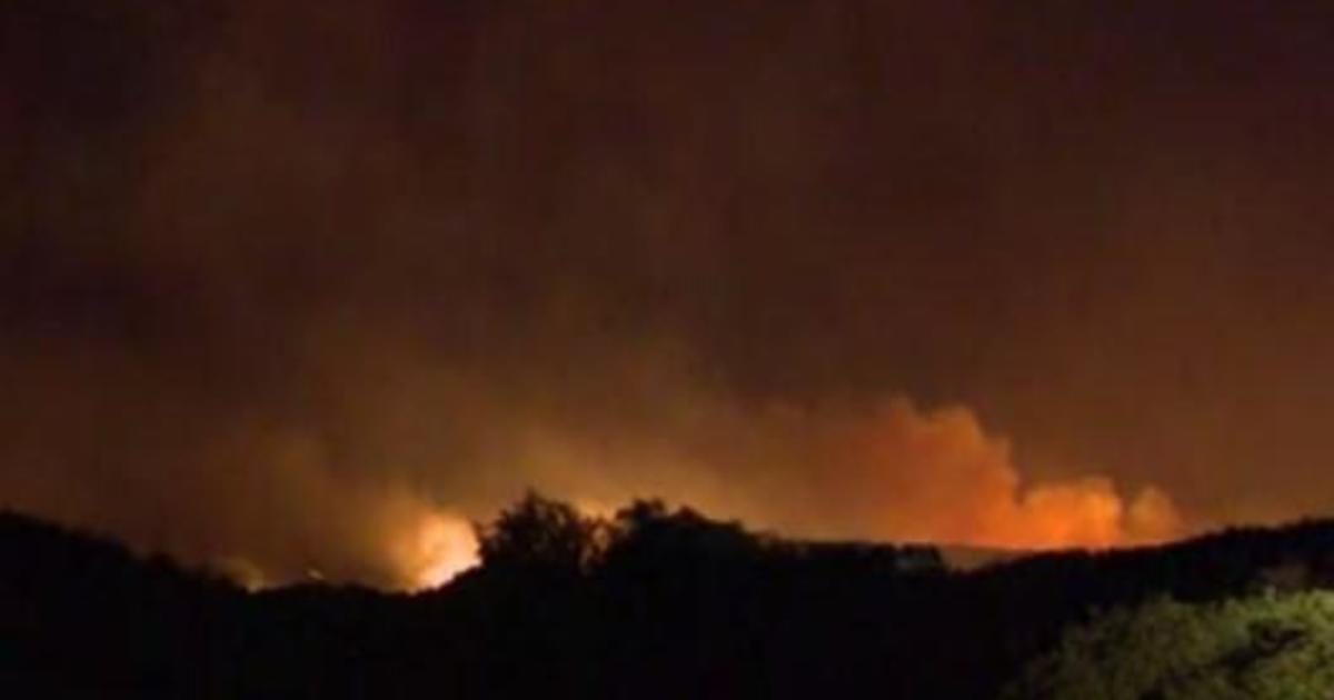 Wildfire fanned by Santa Ana winds forces thousands from their