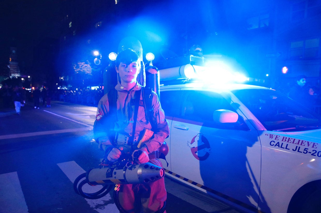 A young man dressed as a character from Ghostbusters attends the Annual Village Halloween parade in New York on October 31, 2023. 