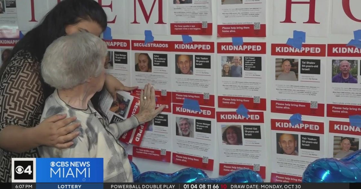 Holocaust survivors hang up posters of those kidnapped by Hamas at Dania Beach Holocaust Middle