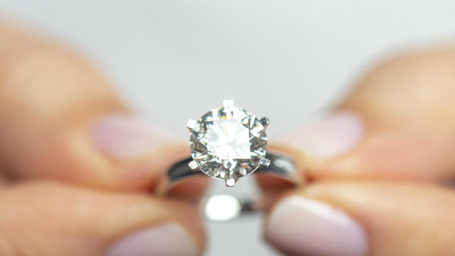 Woman Holding A Diamond Ring 