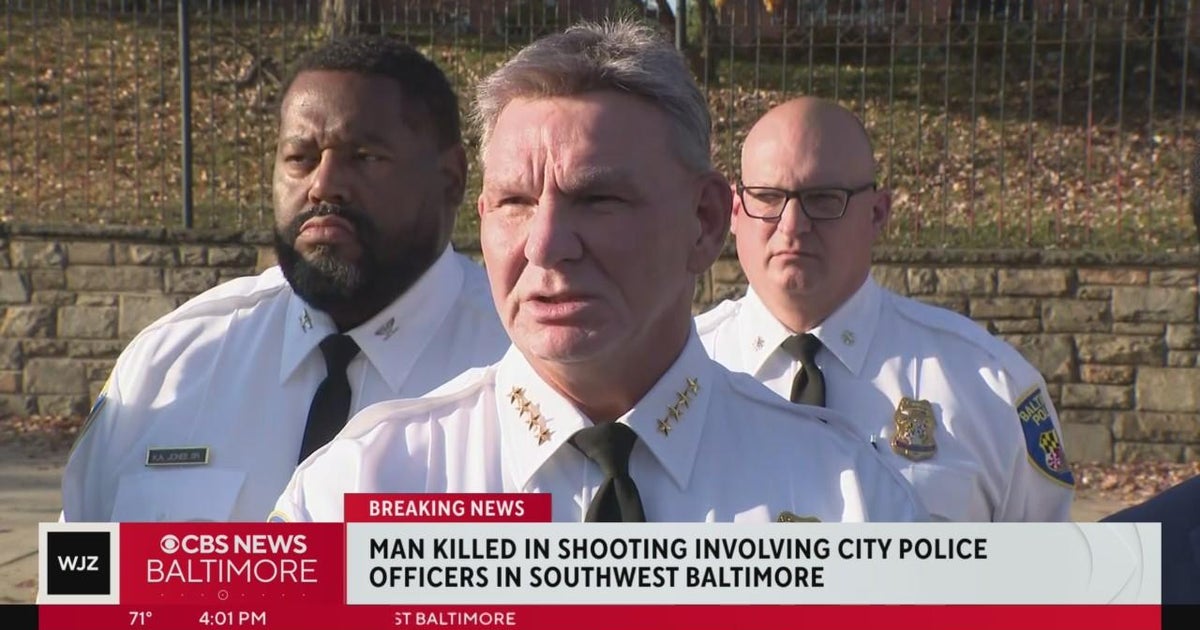 Man shot and killed after police say he pointed gun at officers in ...