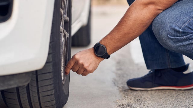 man checking tire