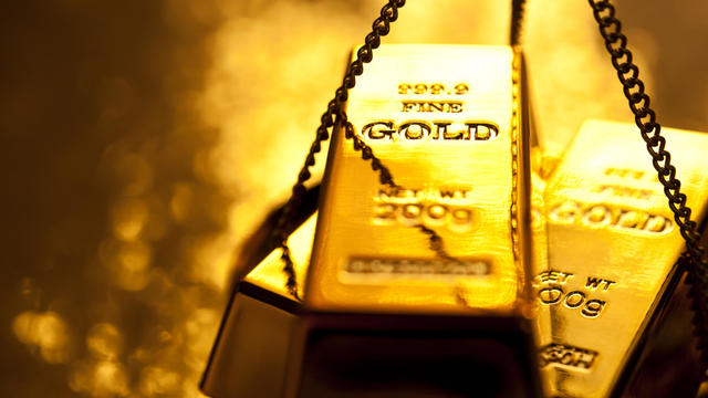 Gold ingot on weight scale 