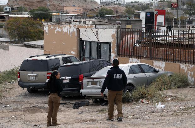 Agents from the Chihuahua prosecutor's office check the area where photojournalist Ismael Villagomez Tapia was murdered in Ciudad Juarez, Mexico, on Nov. 16, 2023. 