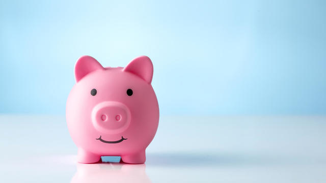 Piggy bank on blue background 