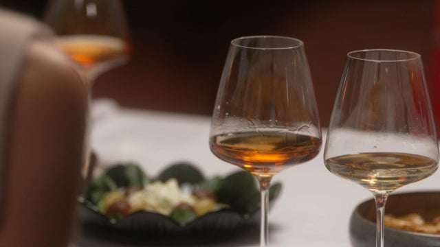 A glass of amber wine 