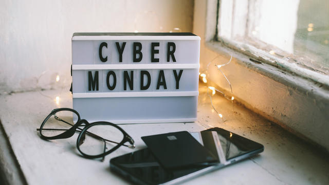 Cyber monday symbol. Lightbox with text Cyber Monday, eyeglasses, payment cards and telehone. 