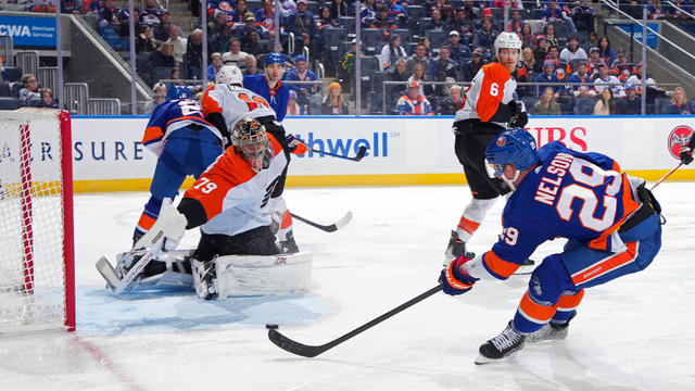 Brock Nelson #29 of the New York Islanders scores a third period goal past Carter Hart #79 of the Philadelphia Flyers at UBS Arena on November 22, 2023 in Elmont, New York. 