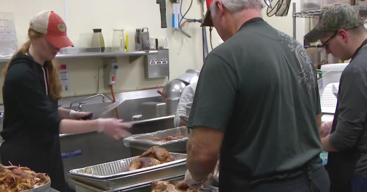 Volunteers gather at Catholic Charities to provide warm Thanksgiving ...