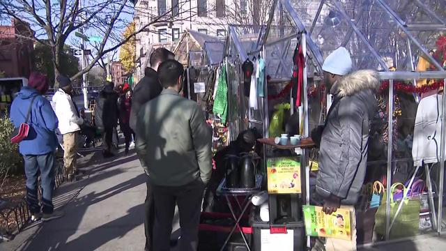 Consumers browse booths at a small business pop-up market in Brooklyn. 