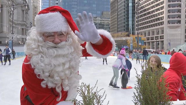 Santa waves from an ice rink in Philadelphia. 