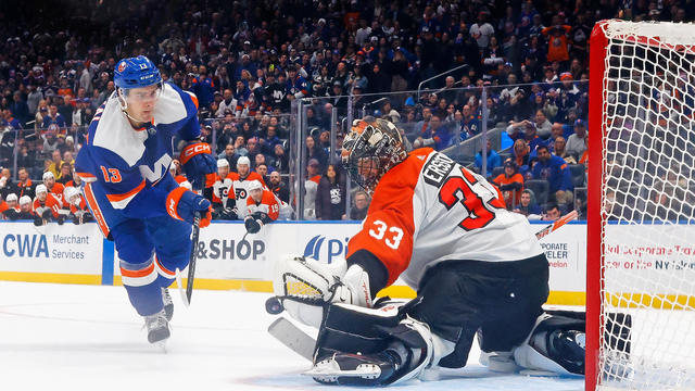 Samuel Ersson #33 of the Philadelphia Flyers makes the shootout save against Mathew Barzal #13 of the New York Islanders at UBS Arena on November 25, 2023 in Elmont, New York. The Flyers defeated the Islanders 1-0 in the shootout. 