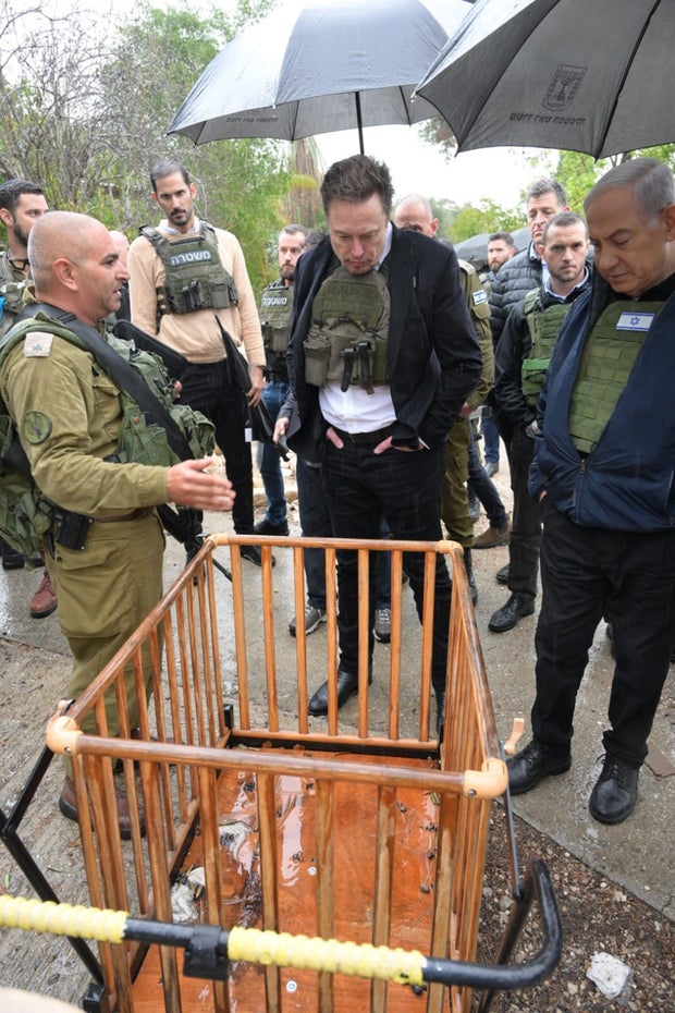 Billionaire and boss of the social network X, Elon Musk, center, traveled to Israel during the temporary cease-fire between Israel and Hamas, Nov. 27, 2023
