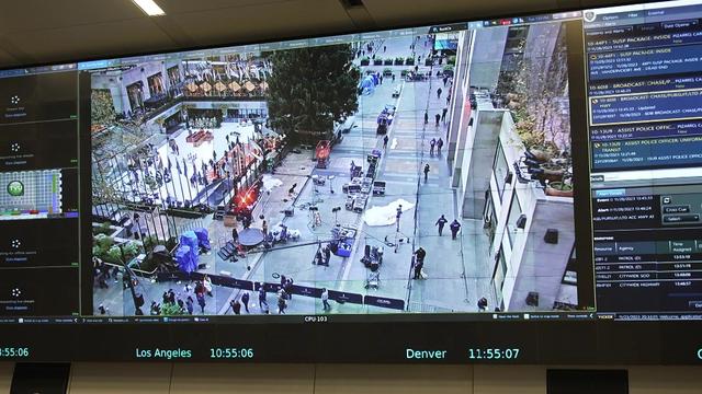 A monitor on a wall shows footage from a surveillance camera at Rockefeller Center. 