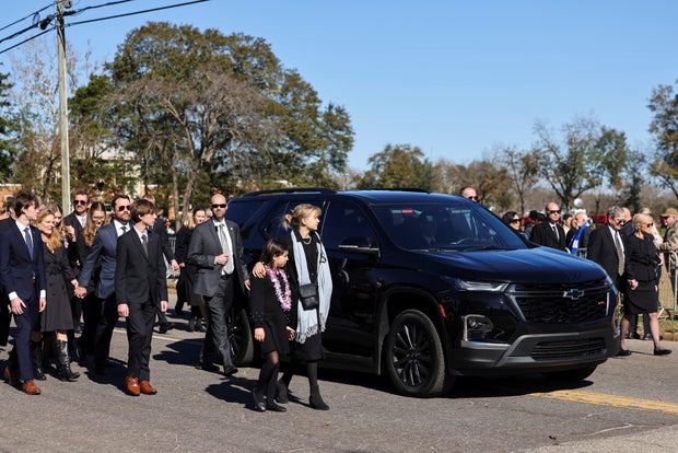 A procession carrying the casket of former U.S. first lady Rosalynn Carter passes through downtown Plains