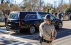 A procession carrying the casket of former U.S. first lady Rosalynn Carter passes through downtown Plains 