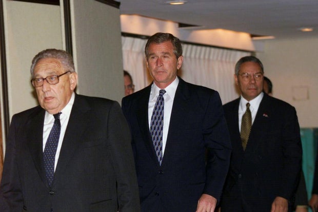 Texas Gov. George W. Bush walks with former Secretary of Sta