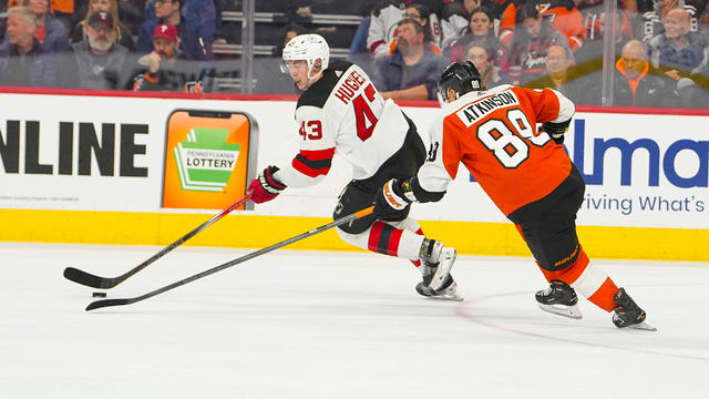 New Jersey Devils Defenseman Luke Hughes (43) skates with the puck against Philadelphia Flyers Right Wing Cam Atkinson (89) during the second period of the National Hockey League game between the New Jersey Devils and the Philadelphia Flyers on November 3 